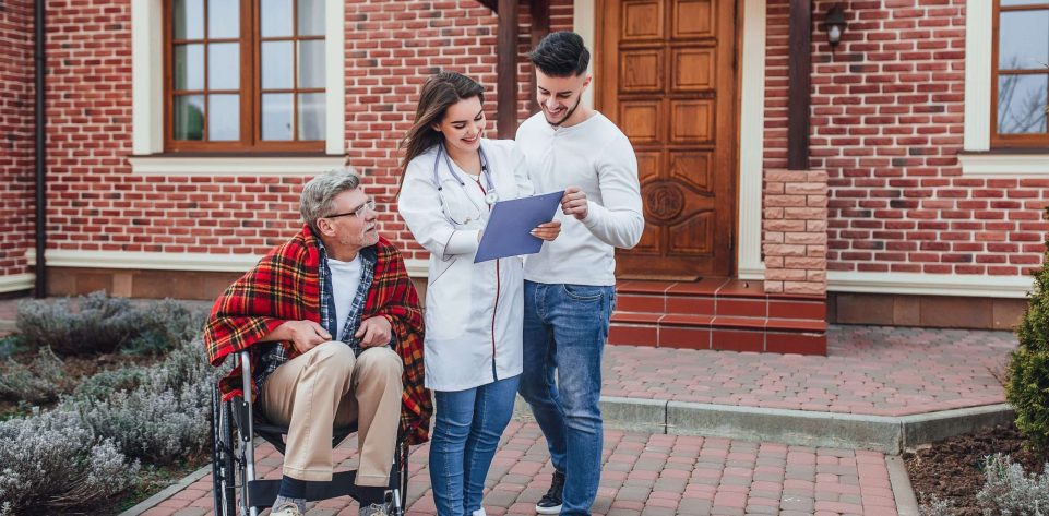son-with-nurse-speaking-about-old-man-whelchair-looking-his-results Son with nurse speaking about old man in whelchair and looking on his resultats!